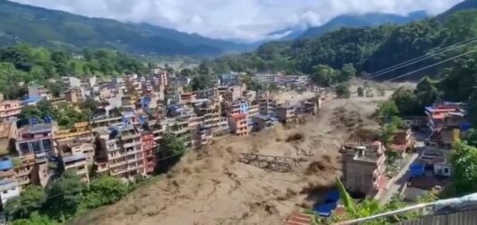 Floodwaters and mudflow through a town in Nepal
